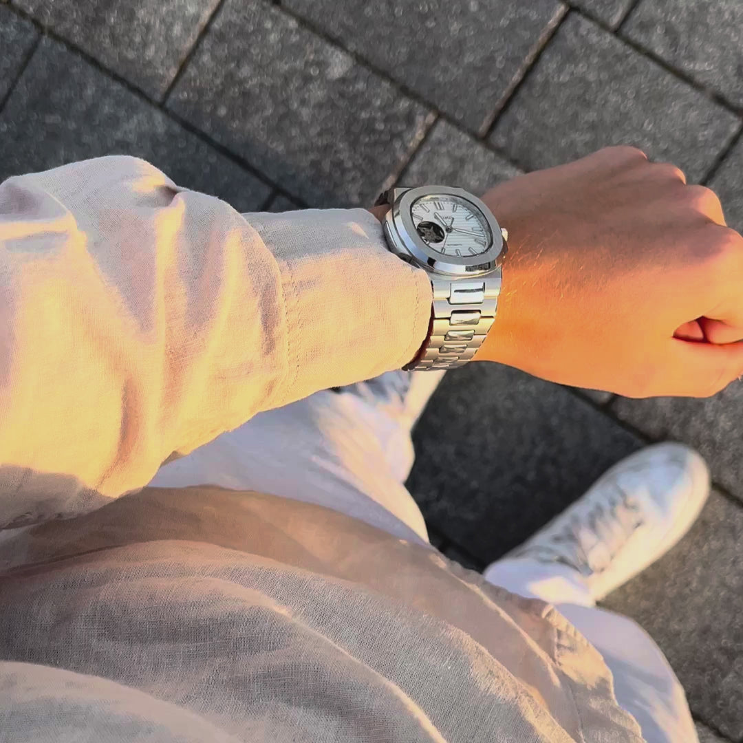 Load video: SEIKO MOD | NAUTILUS | SILVER | WHITE OPEN HEART INDEX DIAL